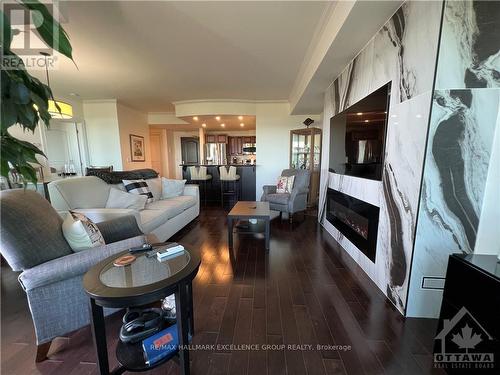 1406 - 100 Inlet, Ottawa, ON - Indoor Photo Showing Living Room With Fireplace