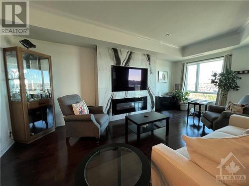 100 Inlet Private Unit#1406, Ottawa, ON - Indoor Photo Showing Living Room With Fireplace