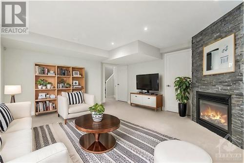 VIRTUALLY STAGED - 1304 Avenue P Avenue, Ottawa, ON - Indoor Photo Showing Living Room With Fireplace