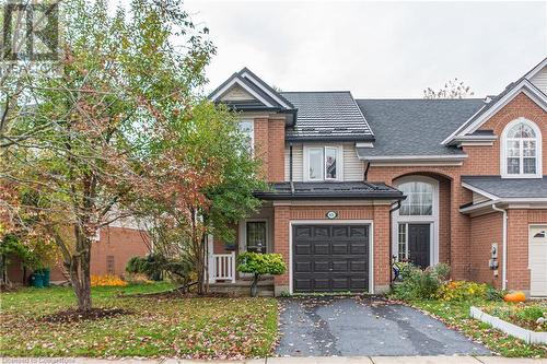 View of front of home with a garage - 421 Beaver Creek Road, Waterloo, ON - Outdoor With Facade