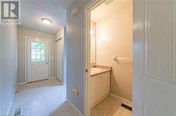 Bathroom with vanity and a textured ceiling - 