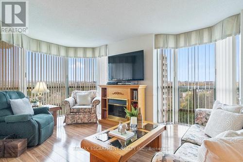 805 - 5080 Pinedale Avenue, Burlington, ON - Indoor Photo Showing Living Room With Fireplace