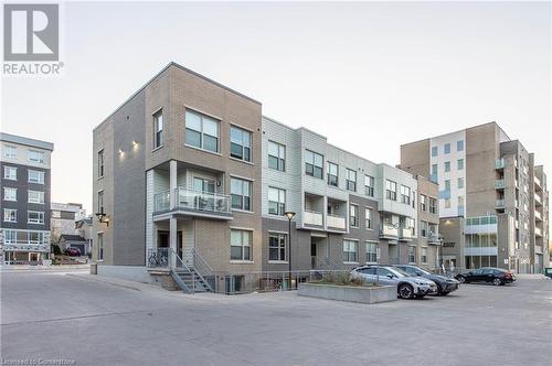 View of building exterior - 62 Balsam Street Unit# T113, Waterloo, ON - Outdoor With Facade