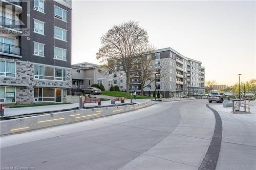 View of outdoor building at dusk - 62 Balsam Street Unit# T113, Waterloo, ON - Outdoor With Facade