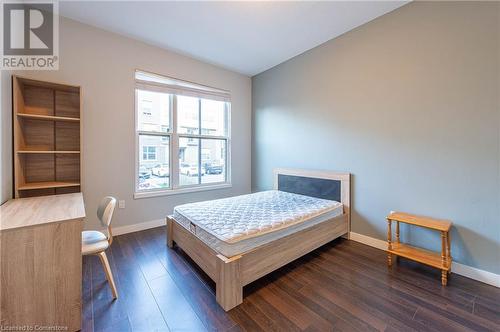 Bedroom featuring dark hardwood / wood-style flooring - 62 Balsam Street Unit# T113, Waterloo, ON - Indoor Photo Showing Bedroom