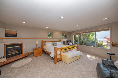 9623 Whitepoint Road, Vernon, BC - Indoor Photo Showing Bedroom With Fireplace