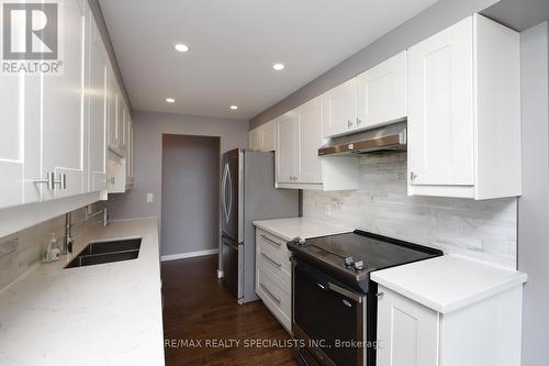 2208 - 3650 Kaneff Crescent, Mississauga, ON - Indoor Photo Showing Kitchen With Double Sink