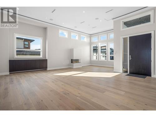 Main Living Room - Ceiling Rope Lighting - 647 Carnoustie Drive, Kelowna, BC - Indoor Photo Showing Other Room