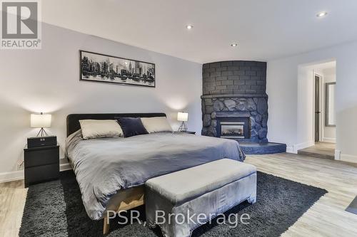 55 Deschene Avenue, Hamilton, ON - Indoor Photo Showing Bedroom With Fireplace