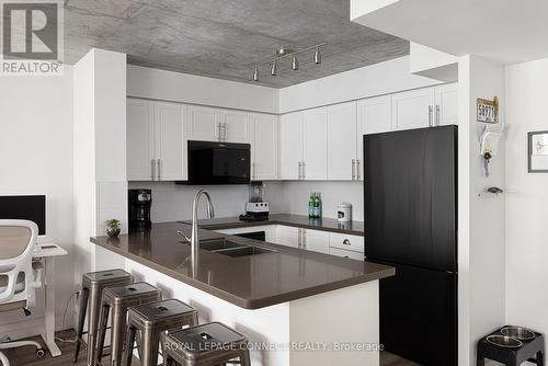 705 - 311 Richmond Street E, Toronto, ON - Indoor Photo Showing Kitchen With Double Sink With Upgraded Kitchen