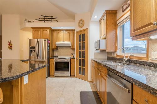 61 Carleton Drive, Steinbach, MB - Indoor Photo Showing Kitchen With Double Sink With Upgraded Kitchen