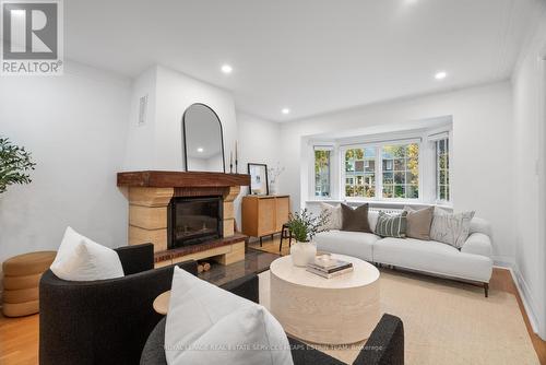 90 Sutherland Drive, Toronto, ON - Indoor Photo Showing Living Room With Fireplace