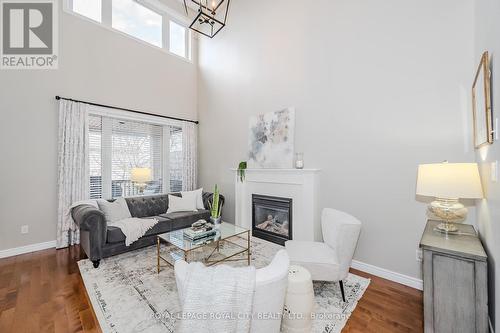 21 - 254 Summerfield Drive, Guelph, ON - Indoor Photo Showing Living Room With Fireplace