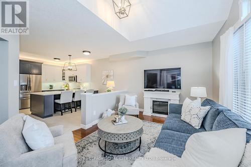 21 - 254 Summerfield Drive, Guelph, ON - Indoor Photo Showing Living Room With Fireplace