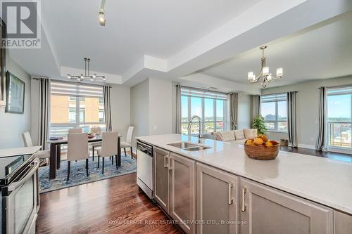 504 - 2470 Prince Michael Drive, Oakville, ON - Indoor Photo Showing Kitchen With Double Sink