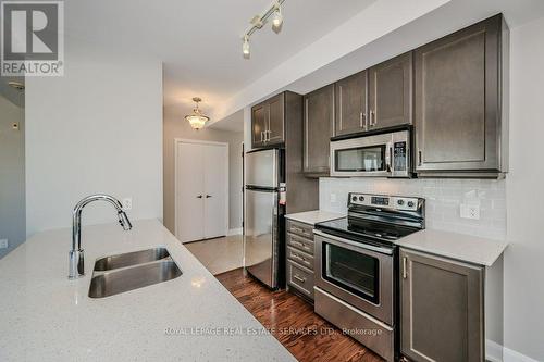 504 - 2470 Prince Michael Drive, Oakville, ON - Indoor Photo Showing Kitchen With Stainless Steel Kitchen With Double Sink With Upgraded Kitchen