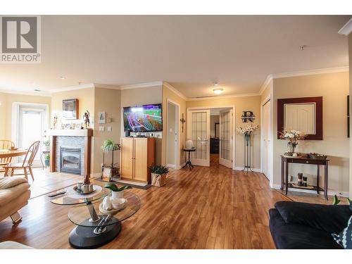 6805 Cottonwood Drive Unit# 400, Osoyoos, BC - Indoor Photo Showing Living Room With Fireplace