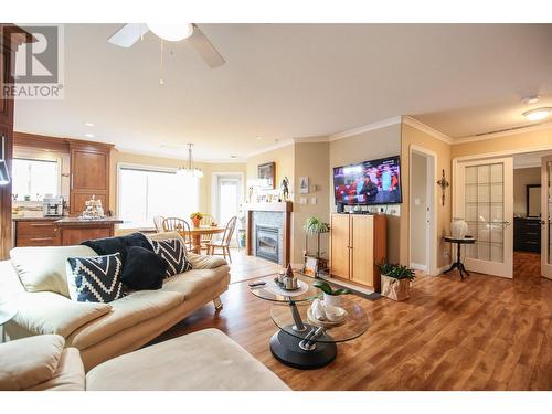 6805 Cottonwood Drive Unit# 400, Osoyoos, BC - Indoor Photo Showing Living Room With Fireplace