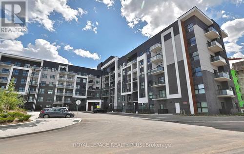 334 - 128 Grovewood Common, Oakville, ON - Outdoor With Balcony With Facade