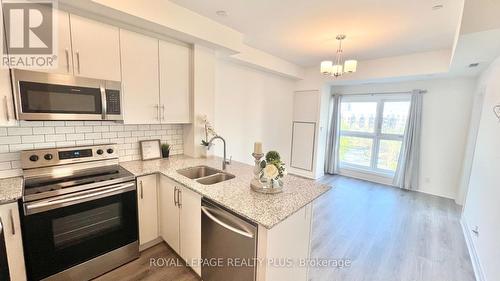 334 - 128 Grovewood Common, Oakville, ON - Indoor Photo Showing Kitchen With Double Sink With Upgraded Kitchen