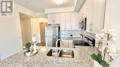 334 - 128 Grovewood Common, Oakville, ON - Indoor Photo Showing Kitchen With Double Sink With Upgraded Kitchen