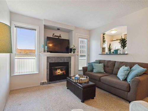 405-2310 Trent St, Victoria, BC - Indoor Photo Showing Living Room With Fireplace