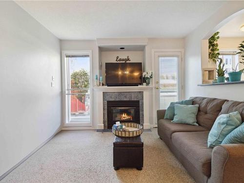 405-2310 Trent St, Victoria, BC - Indoor Photo Showing Living Room With Fireplace