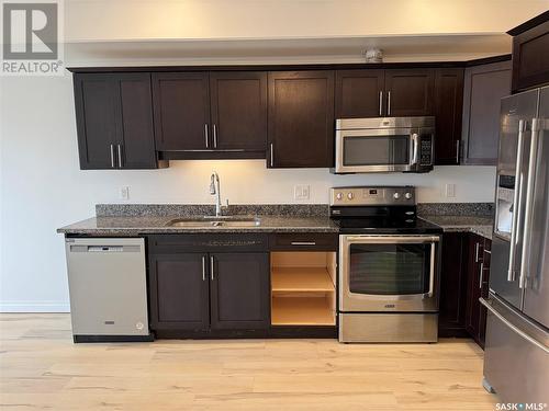 207 412 Willowgrove Square, Saskatoon, SK - Indoor Photo Showing Kitchen With Double Sink