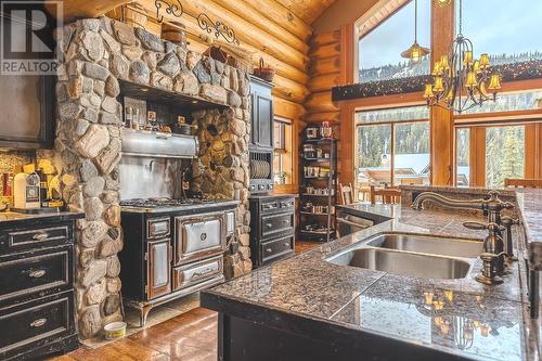 2439 Fairways Drive, Kamloops, BC - Indoor Photo Showing Kitchen With Fireplace With Double Sink