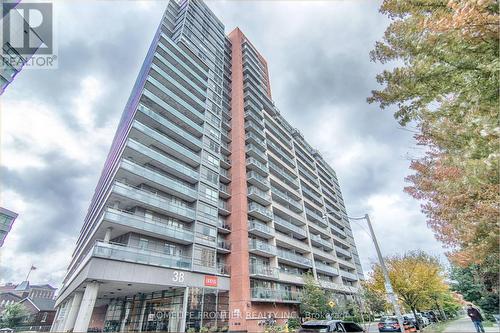 323 - 38 Joe Shuster Way, Toronto, ON - Outdoor With Balcony With Facade