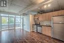 323 - 38 Joe Shuster Way, Toronto, ON  - Indoor Photo Showing Kitchen With Stainless Steel Kitchen With Double Sink 