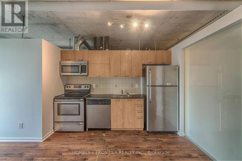 323 - 38 Joe Shuster Way, Toronto, ON - Indoor Photo Showing Kitchen With Stainless Steel Kitchen