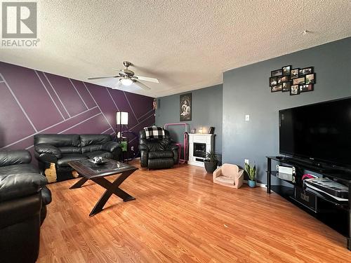 1104 120 Avenue, Dawson Creek, BC - Indoor Photo Showing Living Room With Fireplace