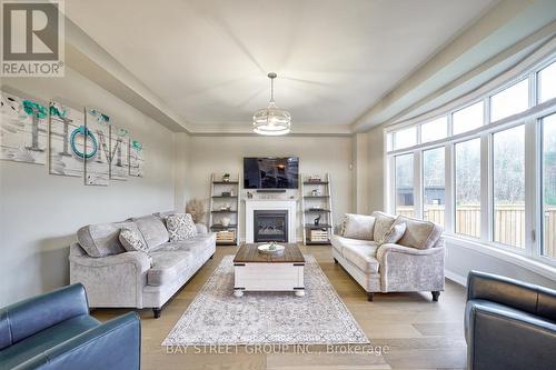 17 Thompson Way, Springwater, ON - Indoor Photo Showing Living Room With Fireplace