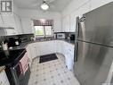 231 18Th Avenue Ne, Swift Current, SK  - Indoor Photo Showing Kitchen With Double Sink 