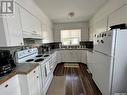 233 18Th Avenue Ne, Swift Current, SK  - Indoor Photo Showing Kitchen With Double Sink 