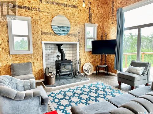 117 Ravine Road, Big Shell, SK - Indoor Photo Showing Living Room With Fireplace