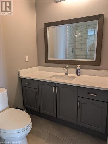 Bathroom with tile patterned flooring, vanity, toilet, and tiled shower - 642 Inglis Falls Place, Waterloo, ON - Indoor Photo Showing Bathroom