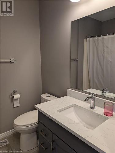 Bathroom with toilet, vanity, and tile patterned floors - 642 Inglis Falls Place, Waterloo, ON - Indoor Photo Showing Bathroom