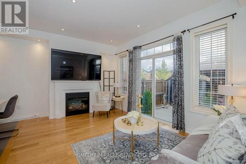 9 Dufay Road, Brampton, ON - Indoor Photo Showing Living Room With Fireplace