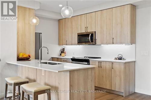 502 - 118 West Street, Port Colborne (878 - Sugarloaf), ON - Indoor Photo Showing Kitchen With Double Sink With Upgraded Kitchen