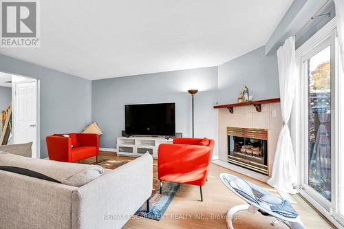 136 Essling Avenue, Hamilton, ON - Indoor Photo Showing Living Room With Fireplace