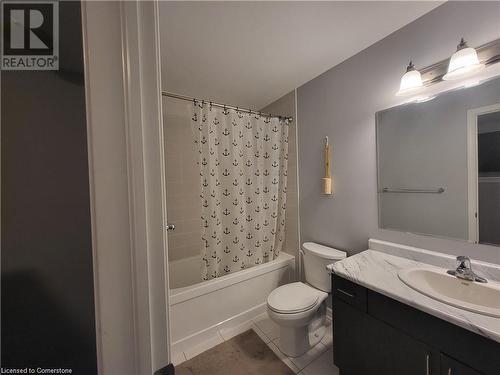 Full bathroom with vanity, shower / tub combo with curtain, tile patterned flooring, and toilet - 39 Appleby Street, Kitchener, ON - Indoor Photo Showing Bathroom