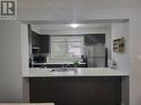 Kitchen with stainless steel appliances, a kitchen bar, sink, and kitchen peninsula - 39 Appleby Street, Kitchener, ON  - Indoor Photo Showing Kitchen With Double Sink 