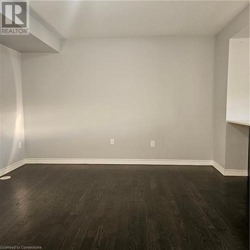 Spare room featuring dark hardwood / wood-style floors - 39 Appleby Street, Kitchener, ON - Indoor Photo Showing Other Room