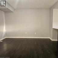 Spare room featuring dark hardwood / wood-style floors - 