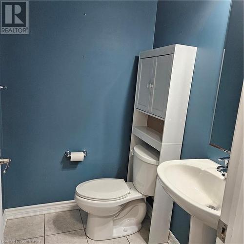 Bathroom featuring tile patterned floors and toilet - 39 Appleby Street, Kitchener, ON - Indoor Photo Showing Bathroom