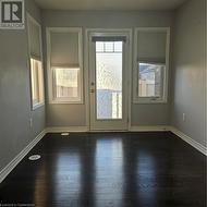 Doorway with dark wood-type flooring - 