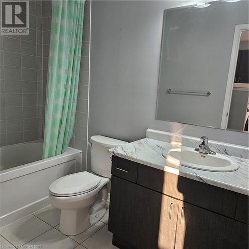 Full bathroom featuring tile patterned flooring, vanity, shower / bath combo, and toilet - 39 Appleby Street, Kitchener, ON - Indoor Photo Showing Bathroom