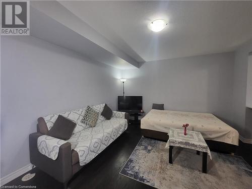 Living room featuring dark wood-type flooring - 39 Appleby Street, Kitchener, ON - Indoor